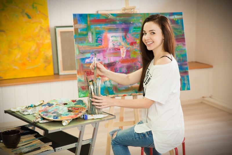 Attractive Woman Painting in Art Studio