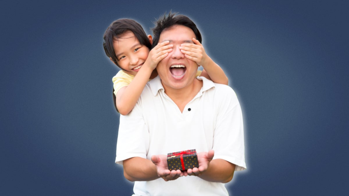 Best Gifts to Dad from Daughter Asian Girl Holding Dads Eyes Closed Holding Gift