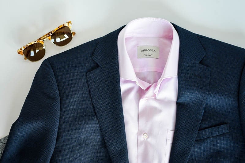 blue suit with pink shirt and sunglasses