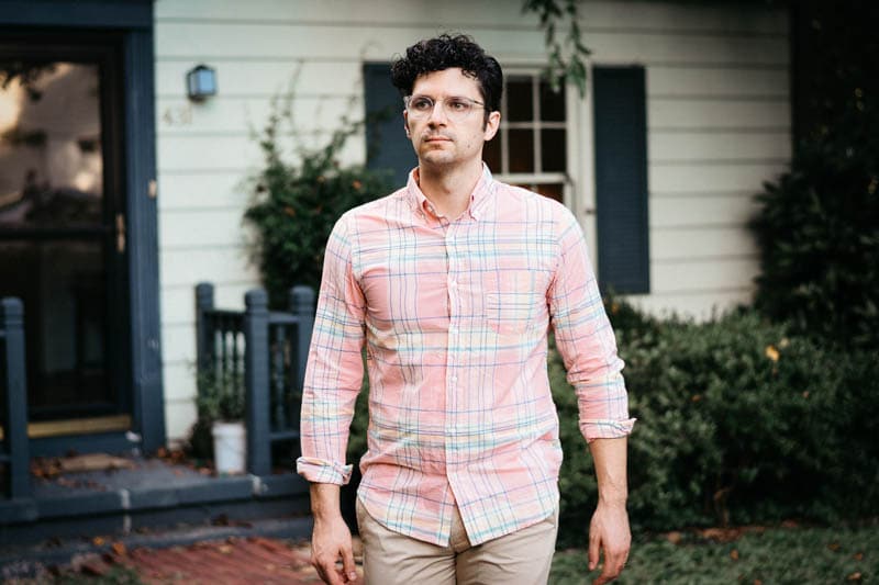 closeup of model wearing pink madras shirt from j.crew