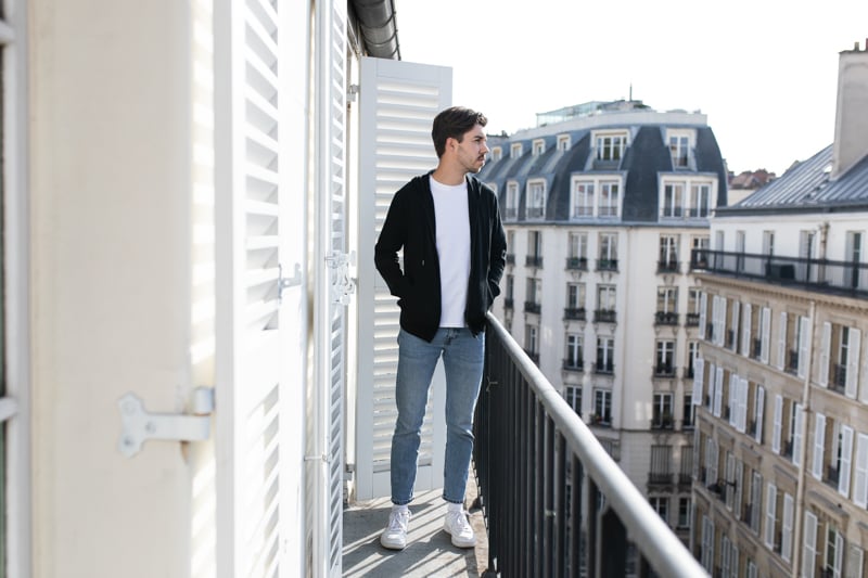 Gobi Cashmere zip hoodie with jeans and tee on balcony