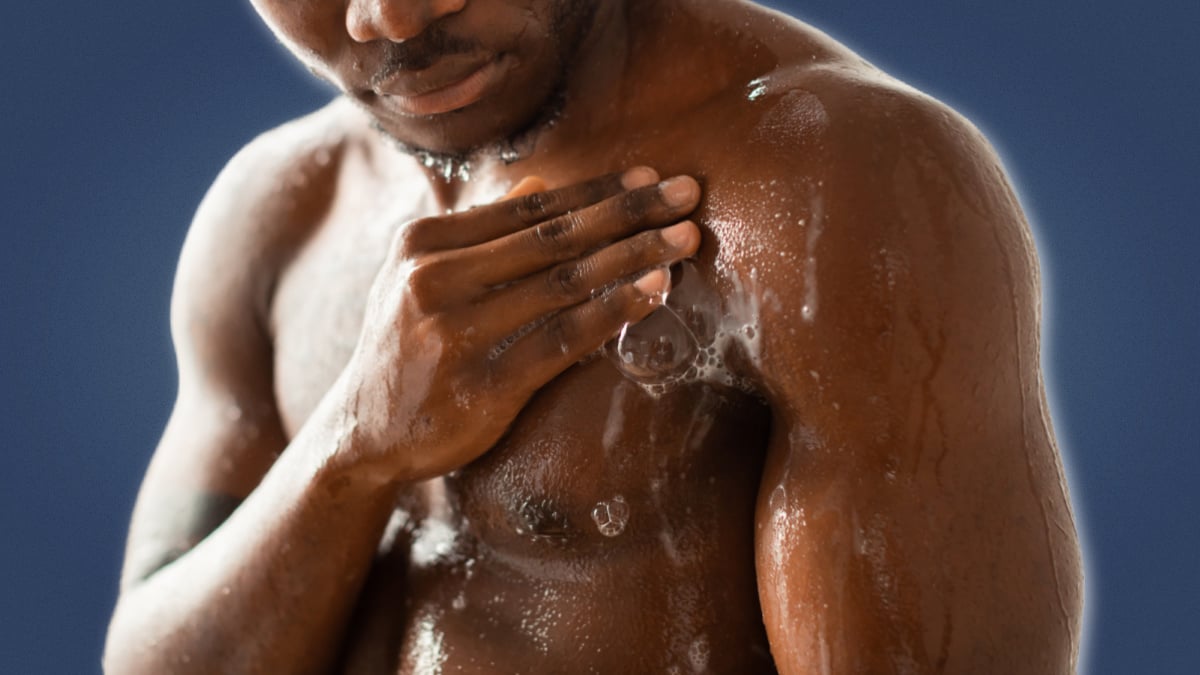 How to properly wash your body Black man washing his body with soap