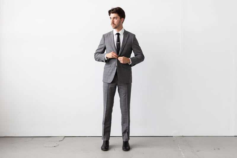Indochino Harrogate Glen Check Suit being buttoned full body