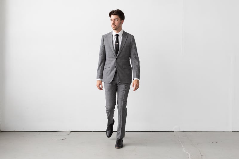 Indochino Harrogate Glen Check Suit being worn walking forward