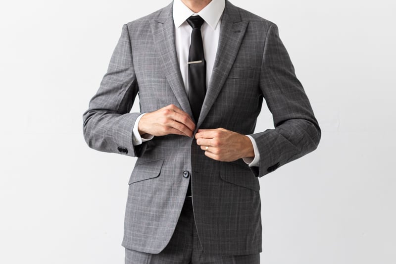 Indochino Harrogate Glen Check Suit buttoning jacket close up