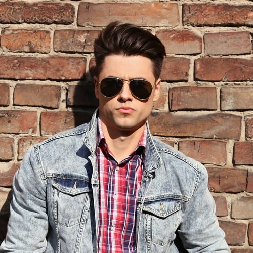 man with square face high wearing aviator sunglasses and with a medium hairstyle
