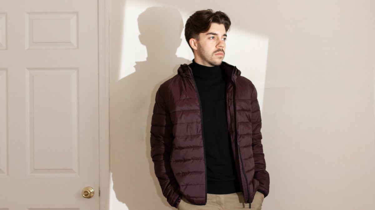 Perry Ellis Review Model Wearing Perry Ellis Chinos Puffer Jacket and Turtleneck