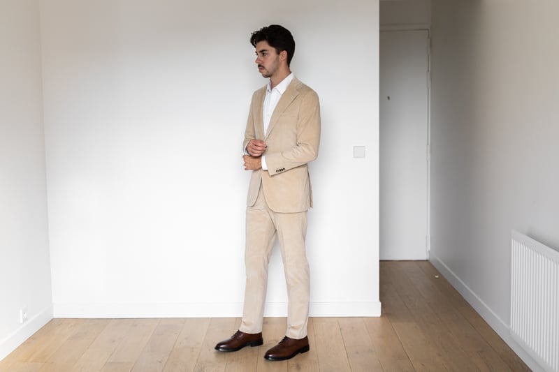 Suitsupply Custom Suit from side on white background