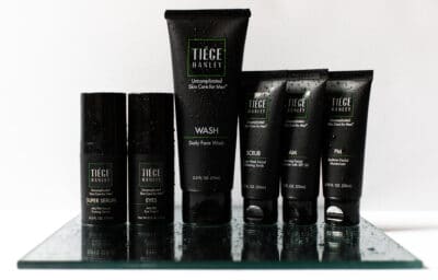 2020/10/Tiege-Hanley-Review_-Skin-Care-Routine-Products-Lined-Up-with-Water-Beads-.jpg