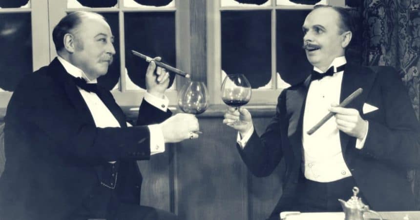 Two men drinking wine and smoking cigars vintage bromance